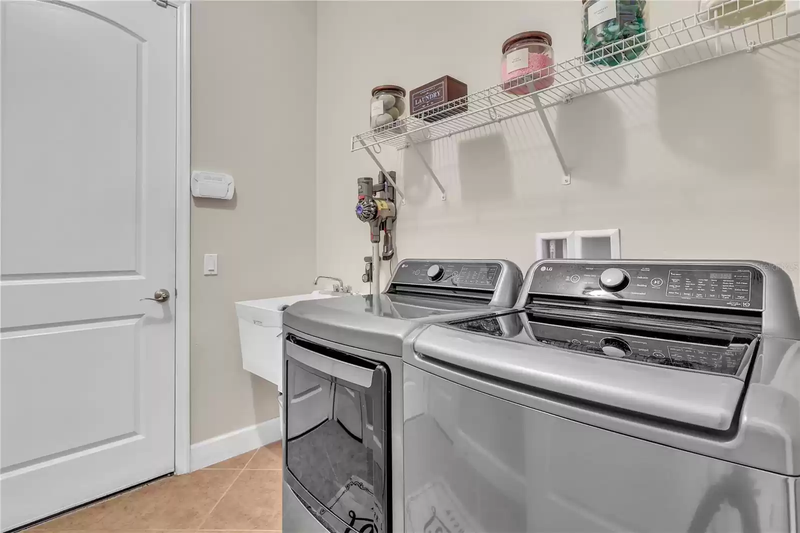 Laundry room with 2 storage closets
