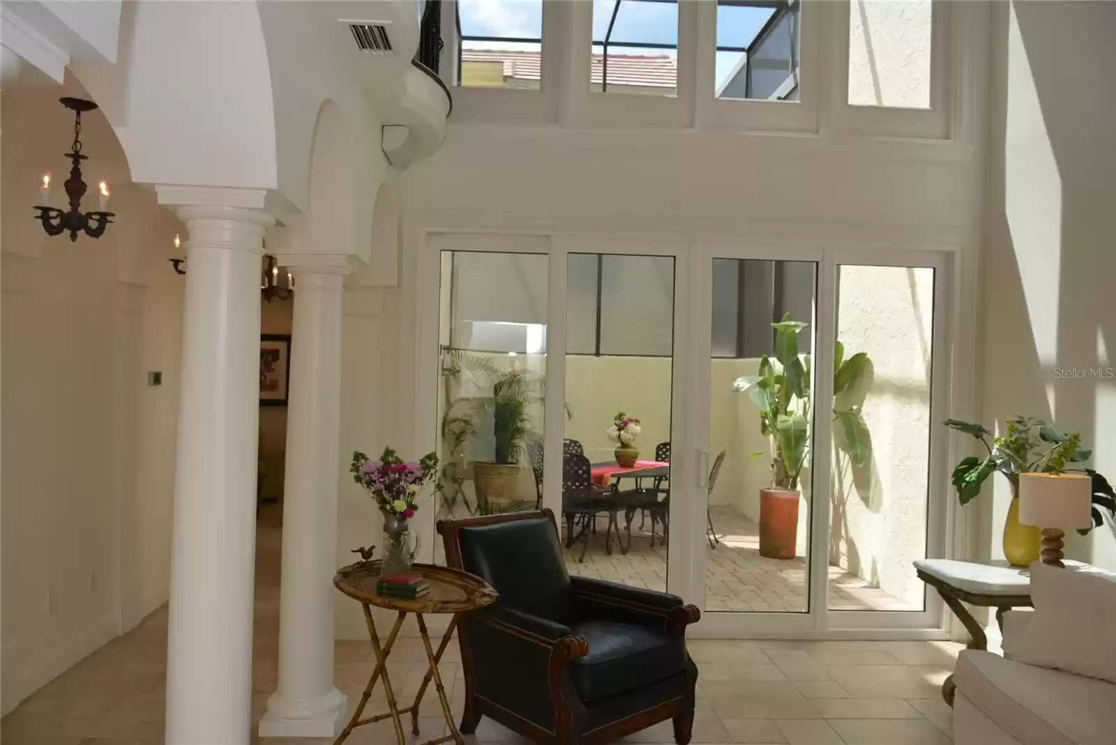 Open the glass sliding doors in the living room for easy flow into the atrium.
