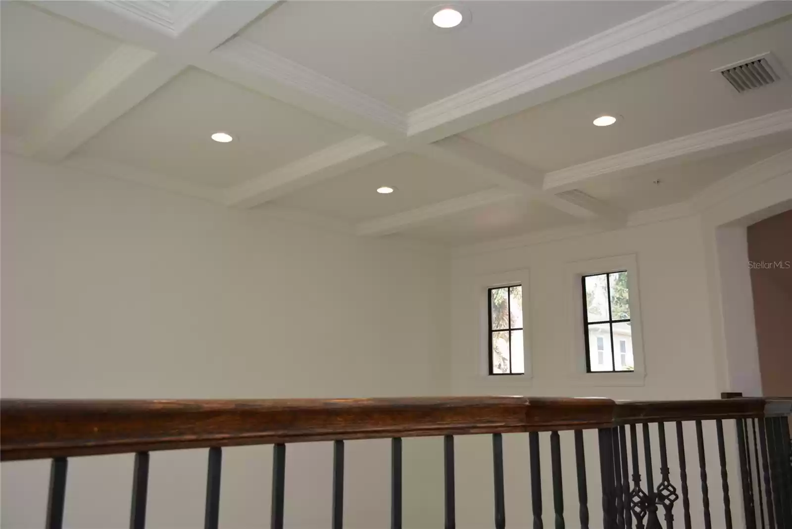 Beautiful coffered ceiling over the living room add architectural interest.