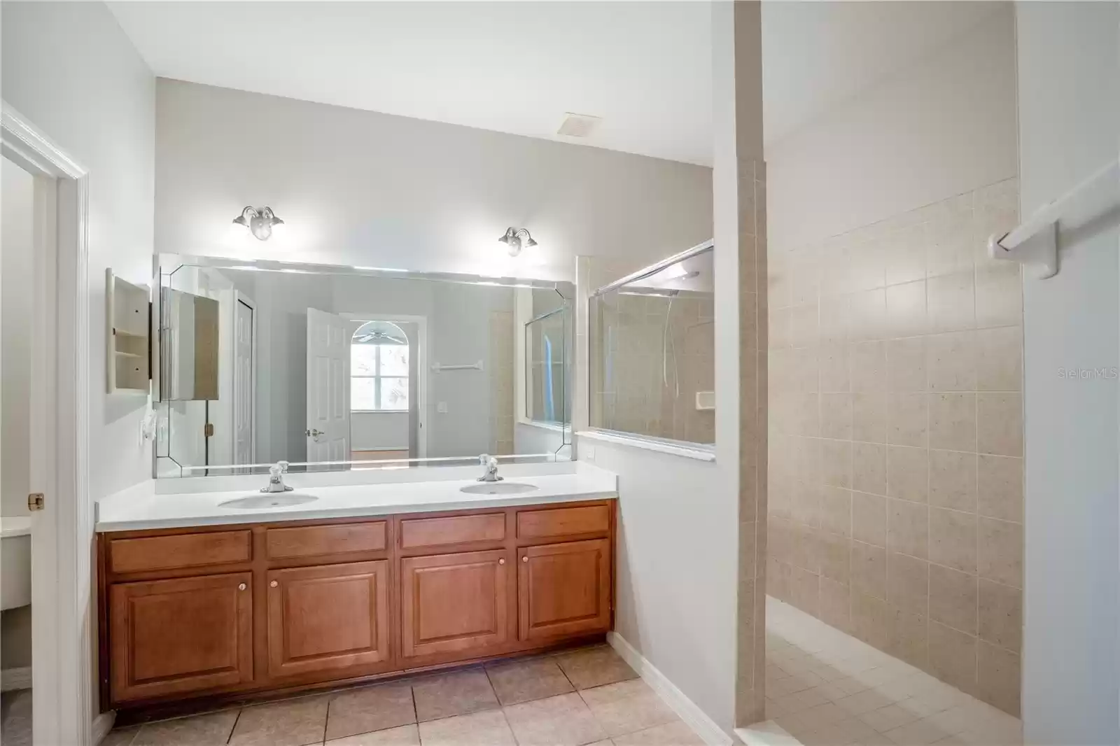 large primary bathroom with double vanity and sinks
