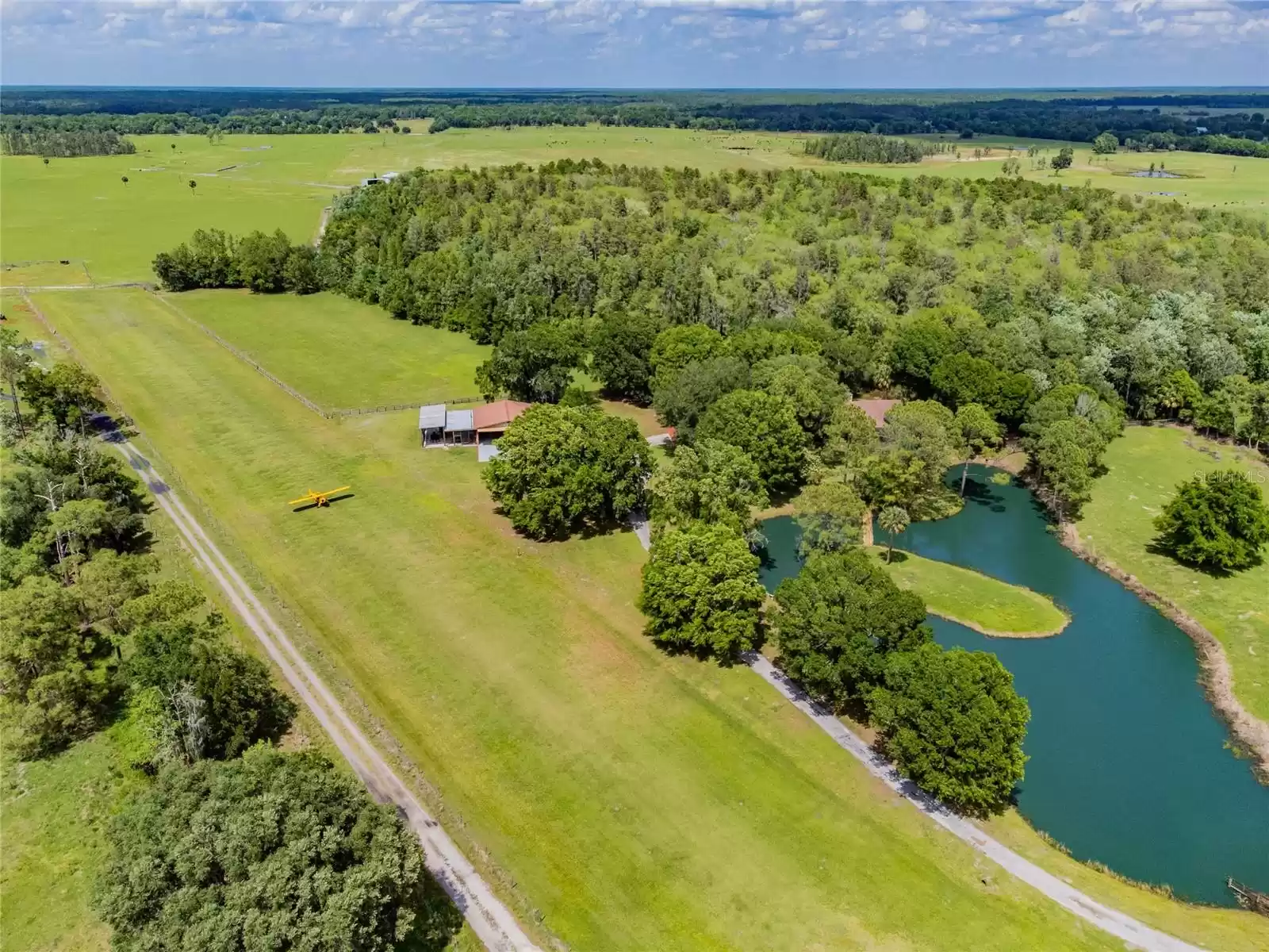 Fenced completely around the perimeter of the property, enjoy the privacy of your own Florida home with a registered airport.